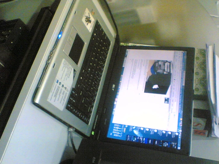 a computer screen in front of a printer