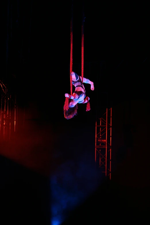 an aerial aerial stunt act in the dark