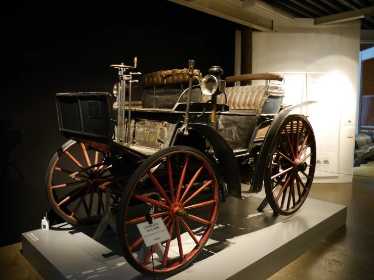 an antique car is displayed in the museum