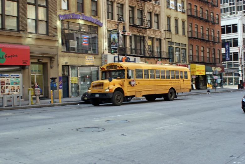 a school bus sits in front of an old building