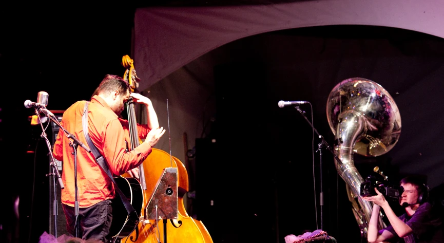 some people on stage with some trombone instruments