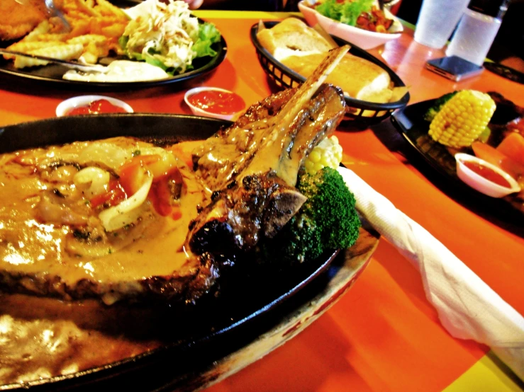 a large tray full of food sits on the dining table