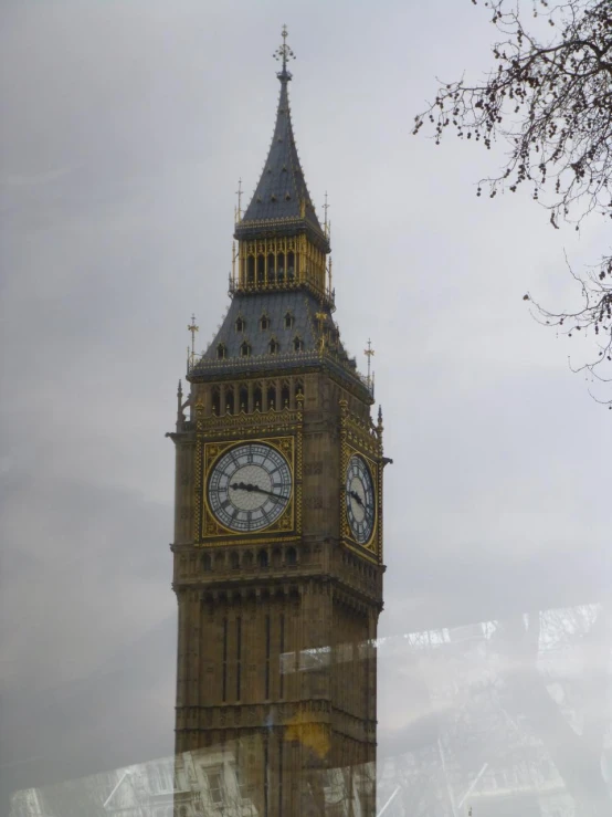 the big ben clock tower in london is surrounded by trees