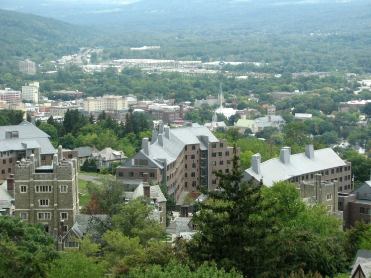 a city is pictured in the foreground surrounded by mountains