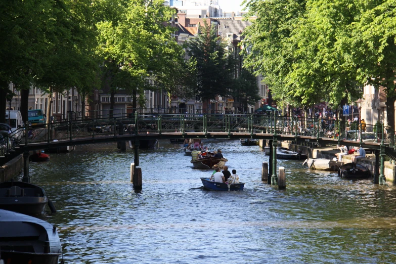 a couple of boats floating down a canal