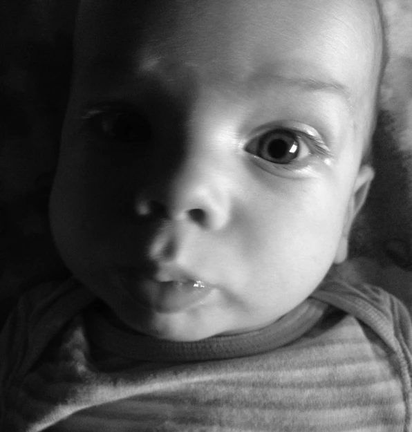 a black and white po of a baby's eyes