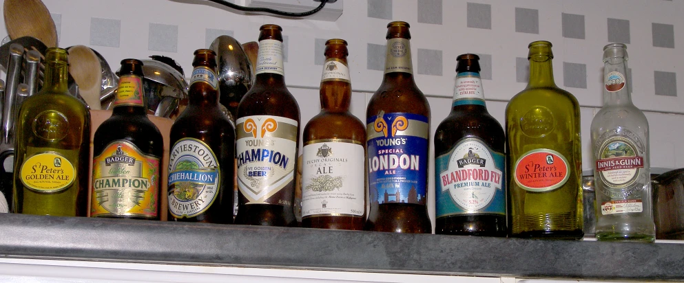 many bottles of beer are lined up on the shelves
