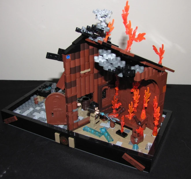 a set of a brick building with fire coming out of it