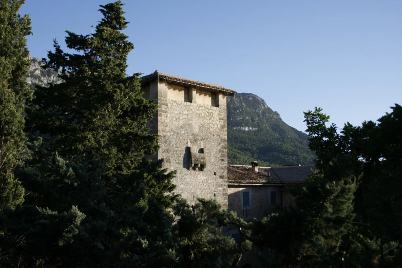 a tall building with trees surrounding it