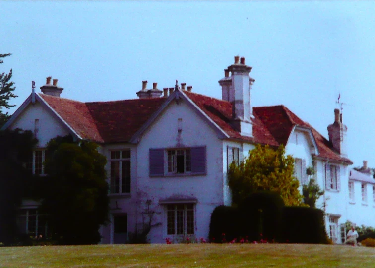 a big pretty home with a clock tower