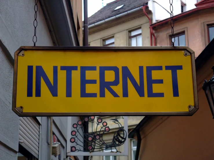there is a sign that says internet attached to a wall