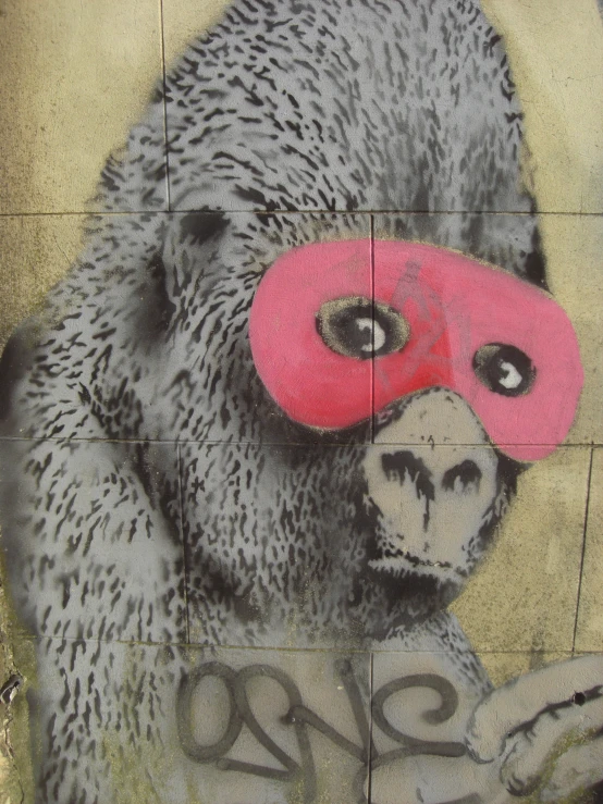 a painted image of a gorilla is shown with a pink mask on his face