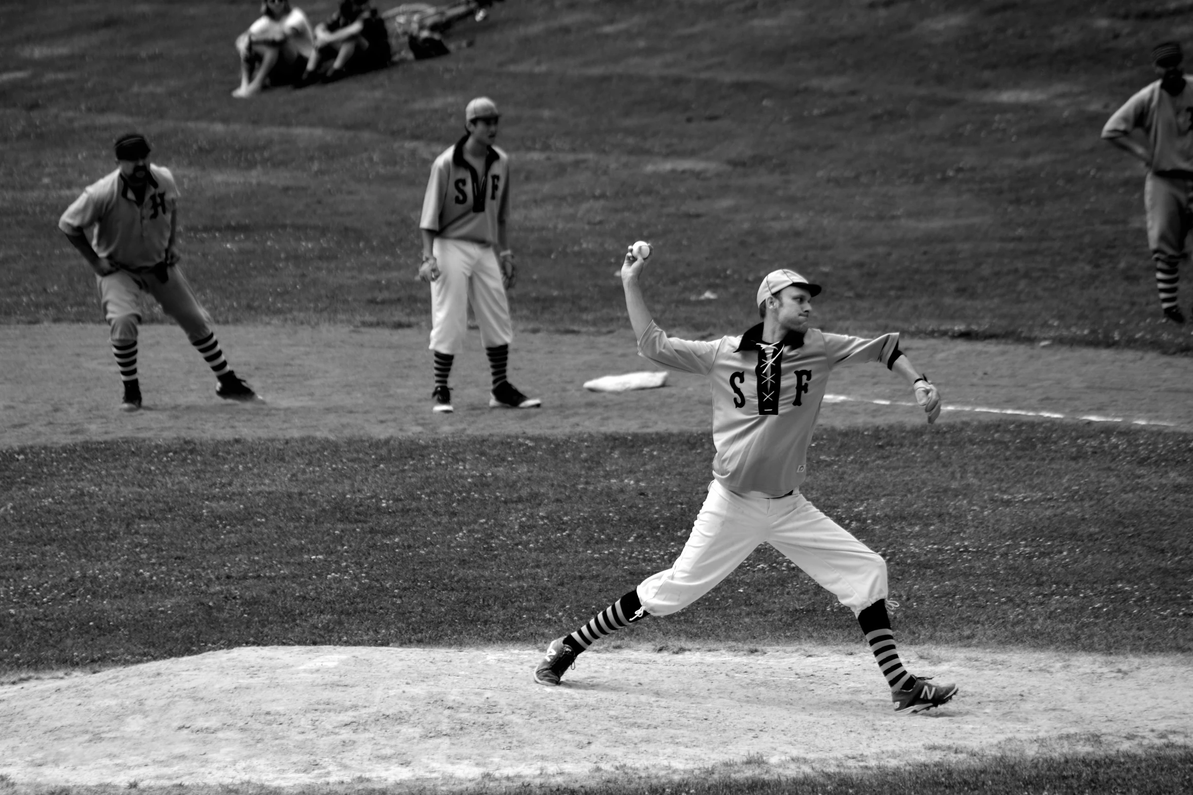 baseball player about to throw a ball in a game