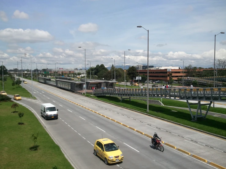 cars on the highway with motor bikes driving through