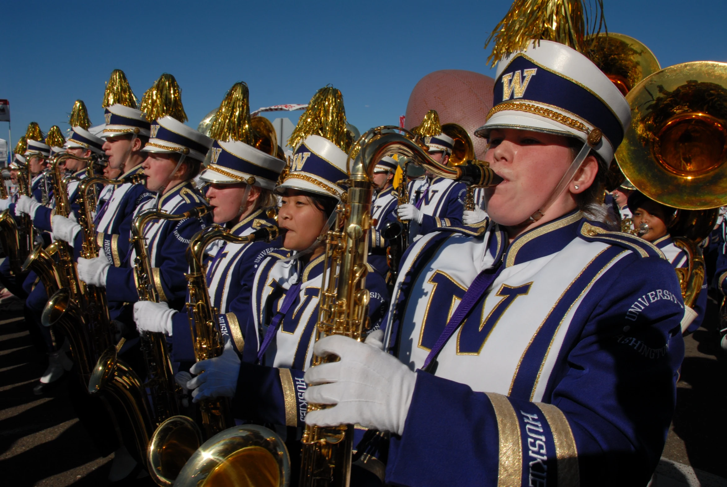 the marching band is performing for the crowds