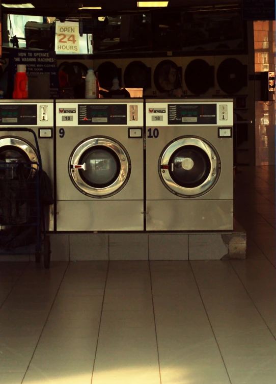 a large number of washing machines are in the store