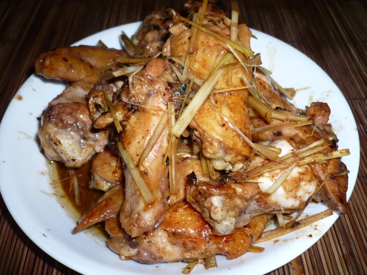 a plate of chicken with an asian style sauce