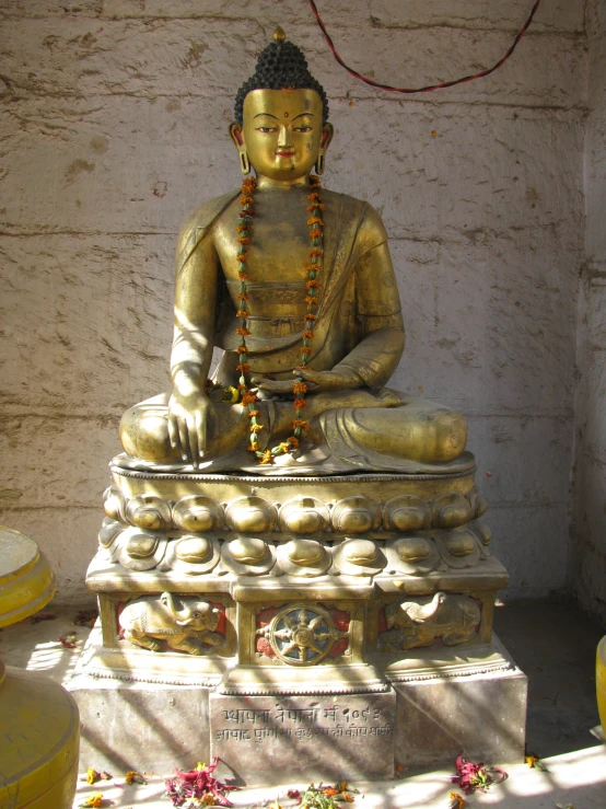 a buddha statue is shown outside the house