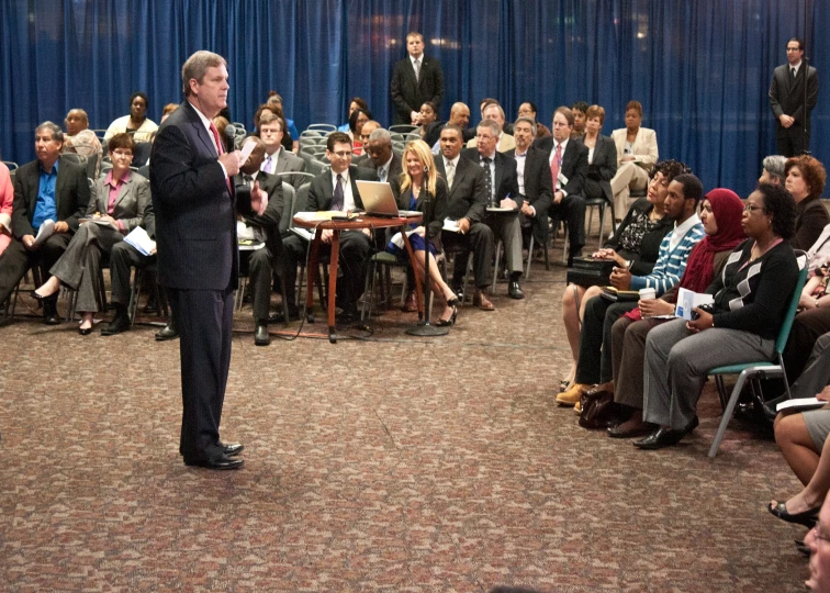 a man standing in front of a group of people