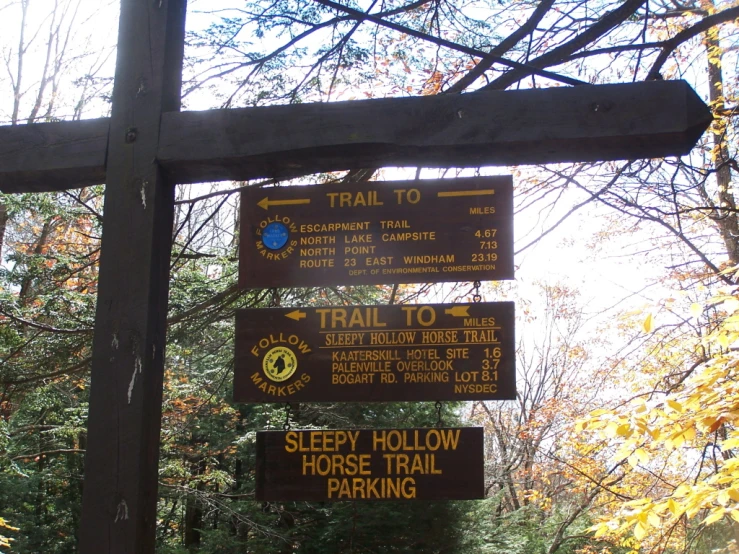 there are signs with directions at the top of the hike