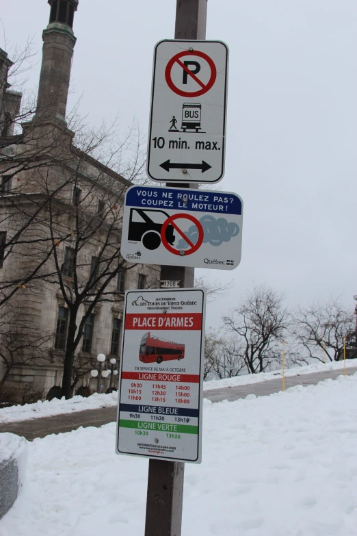 street signs, with a traffic sign behind them