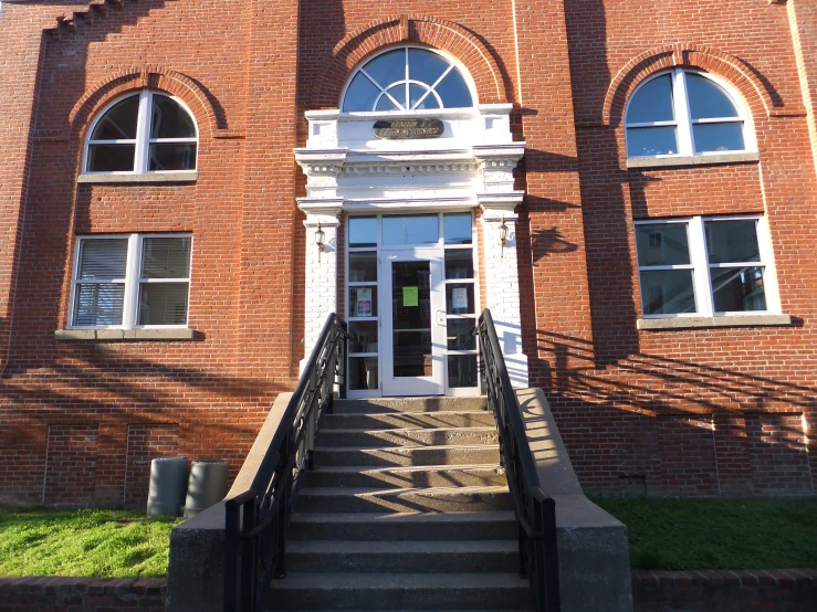 a large brick building with steps to it