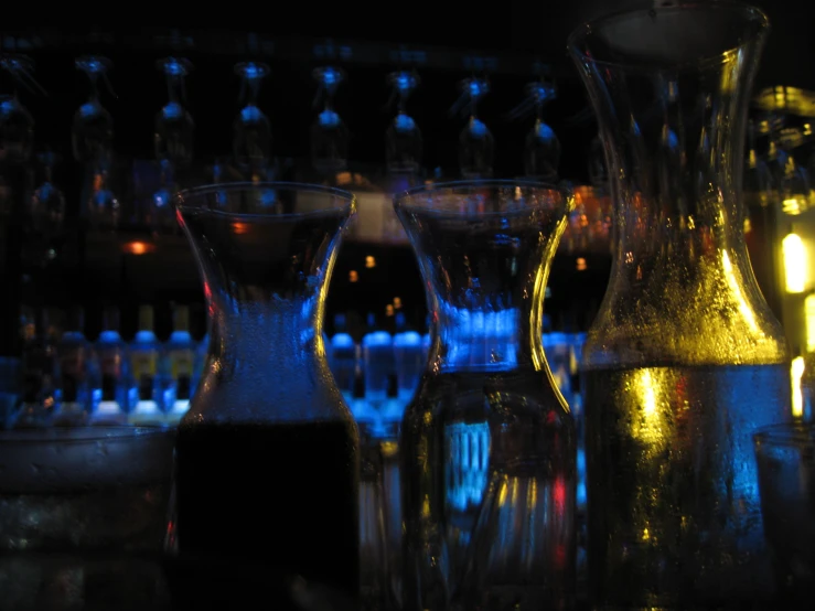 a bar is illuminated by colored candles