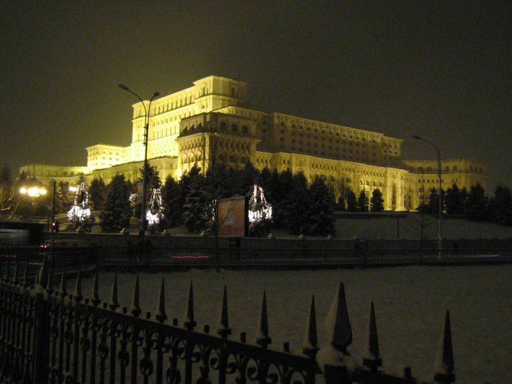 a very large castle lit up by christmas lights