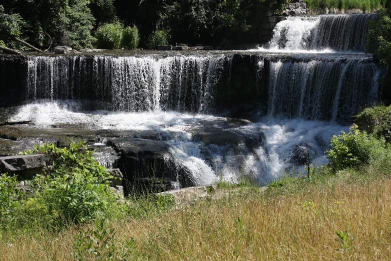 a big waterfall in a very pretty field