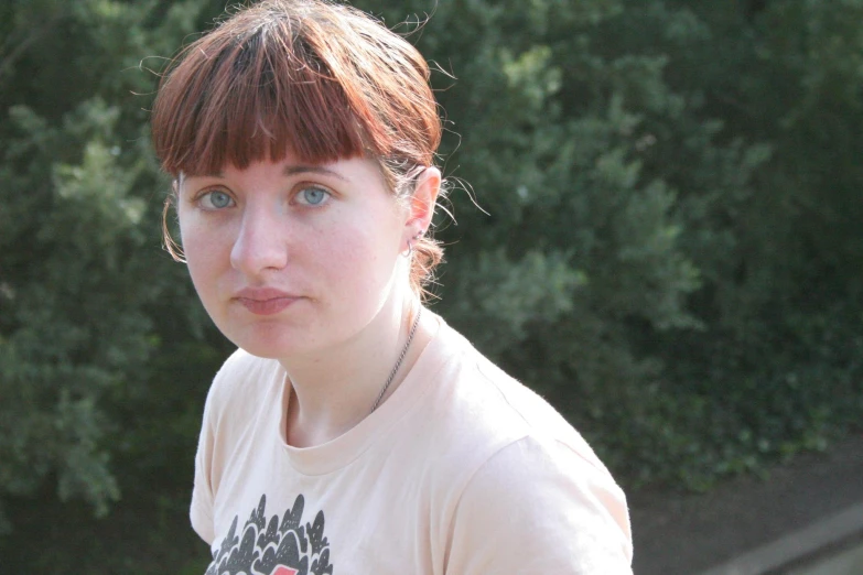 a close up of a woman with red hair