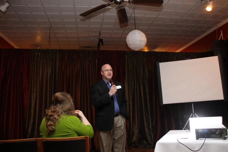 a man giving a presentation at an event