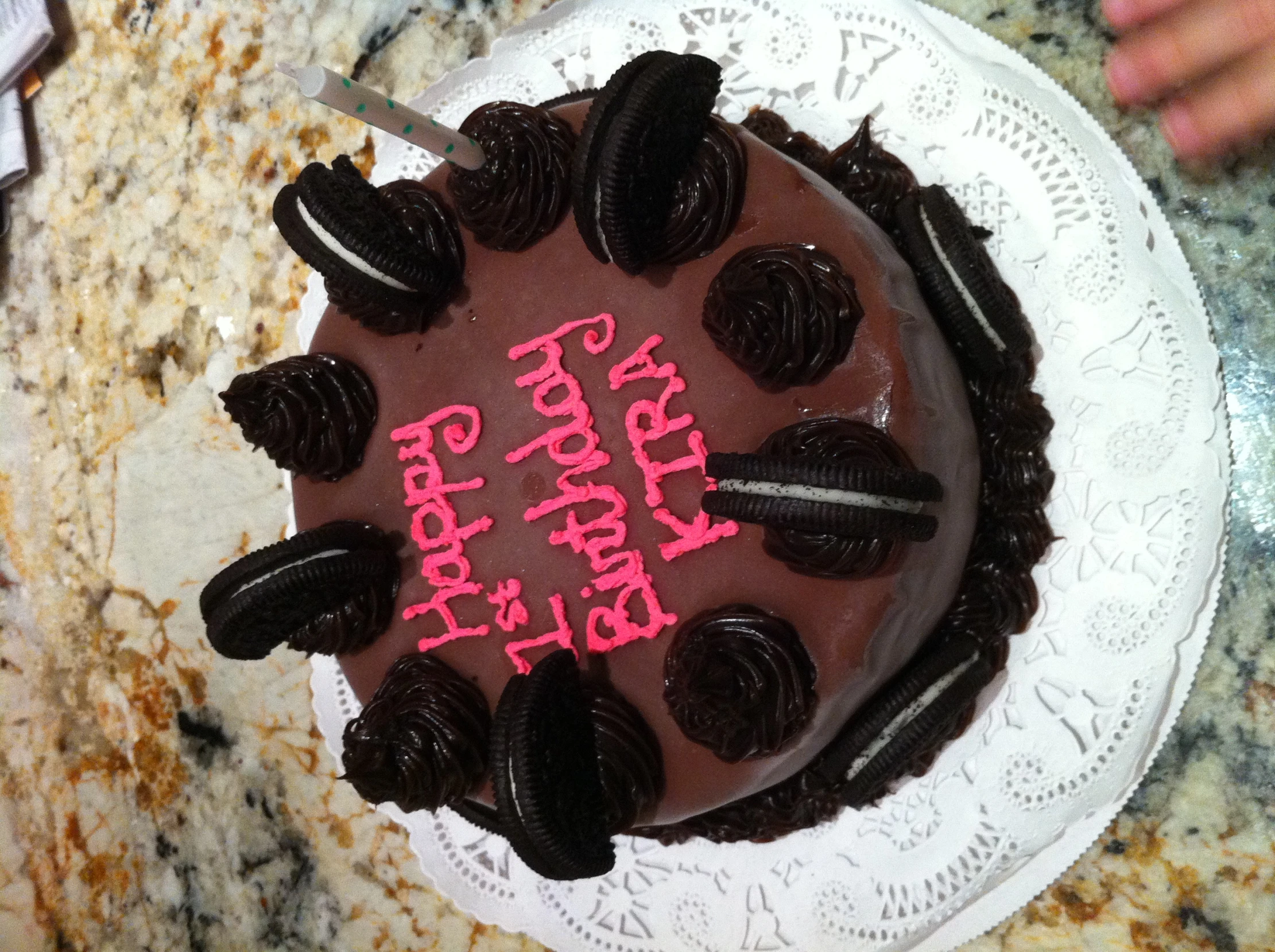 birthday cake with white frosting and pink frosting that says happy 1st birthday to the firm