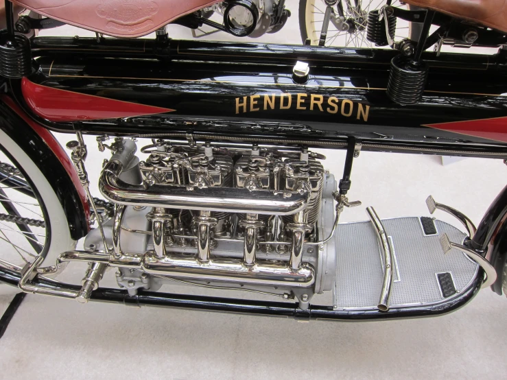 a vintage red and black motorcycle engine in closeup