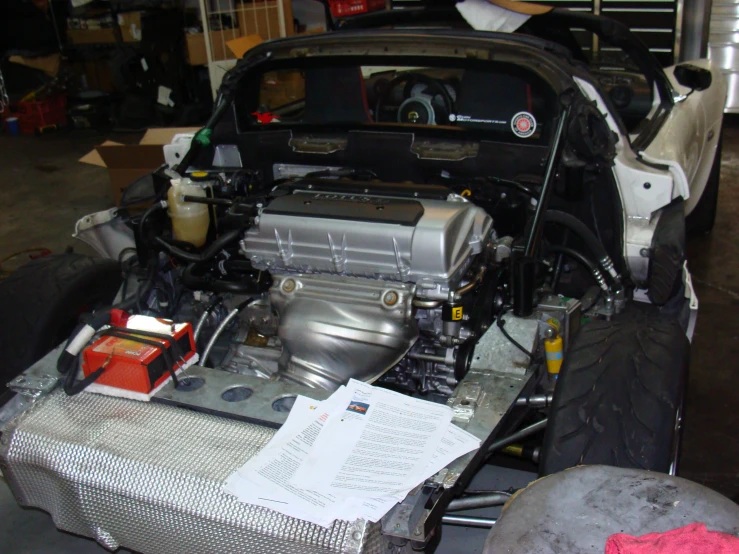 the engine compartment of a car is shown