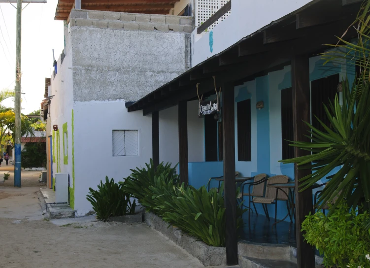 there is an outdoor cafe on a beach