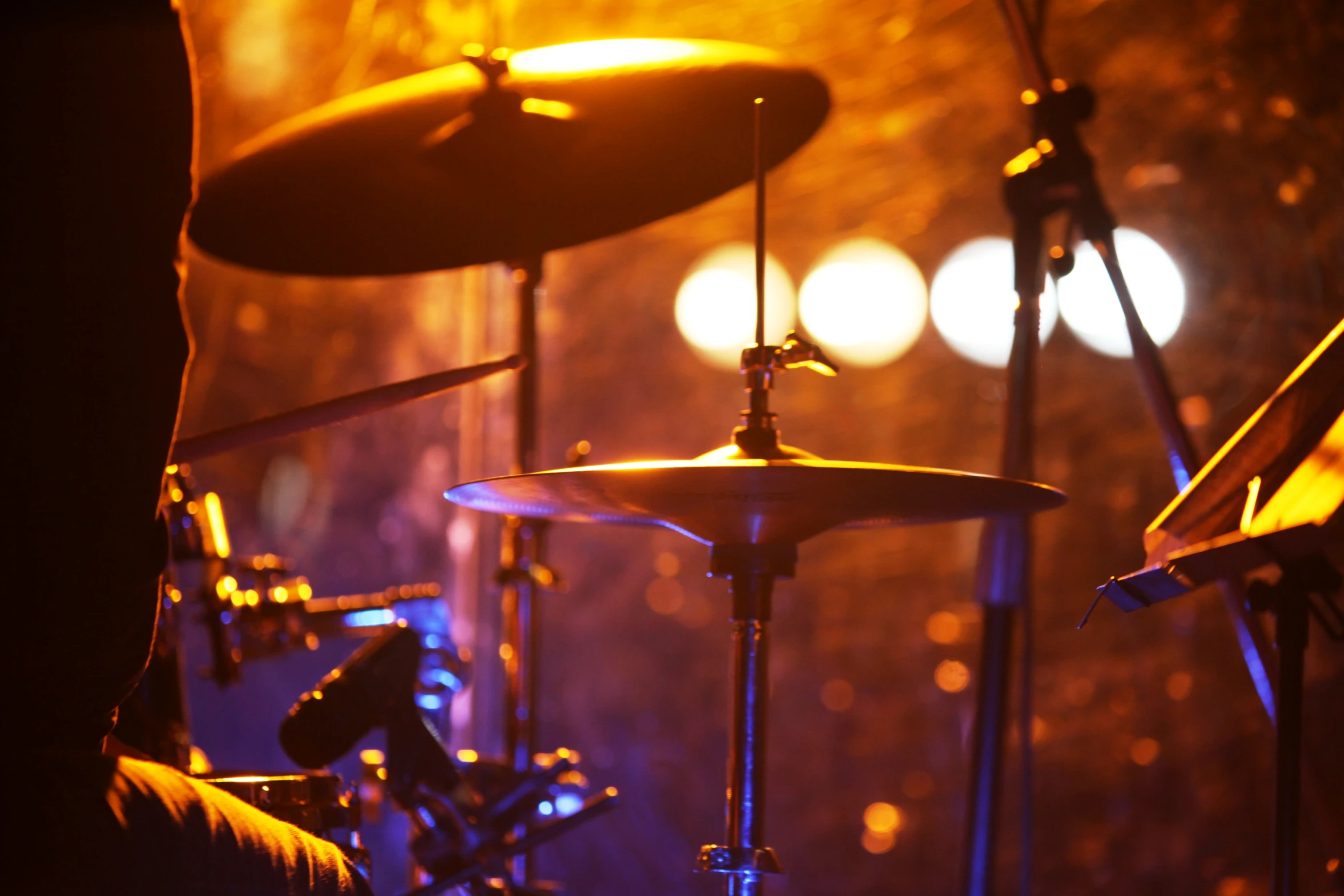 a drummer on stage playing drums at a concert