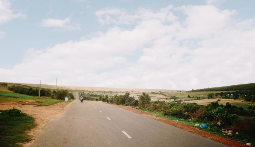 an image of the view from a vehicle driving on a road