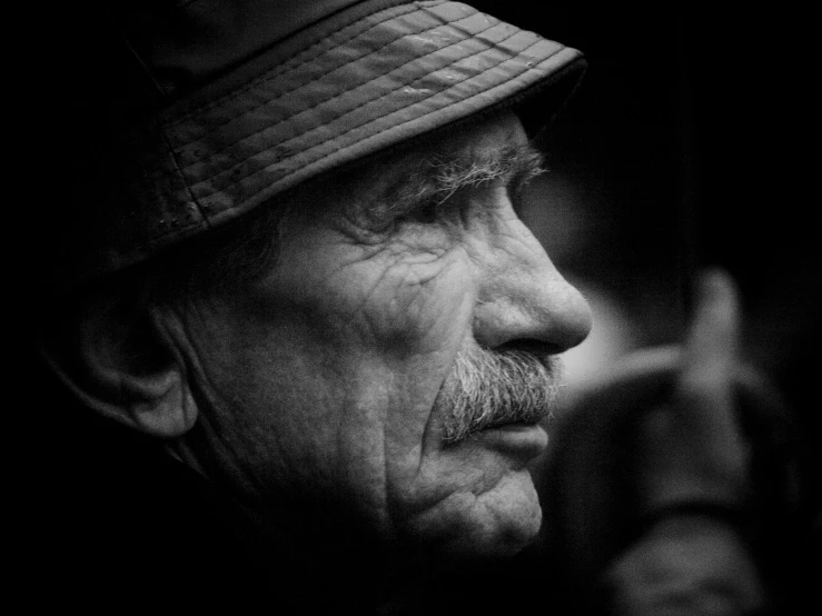 black and white pograph of an elderly man with a mustache