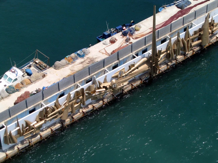 a large boat docked in the water near a dock