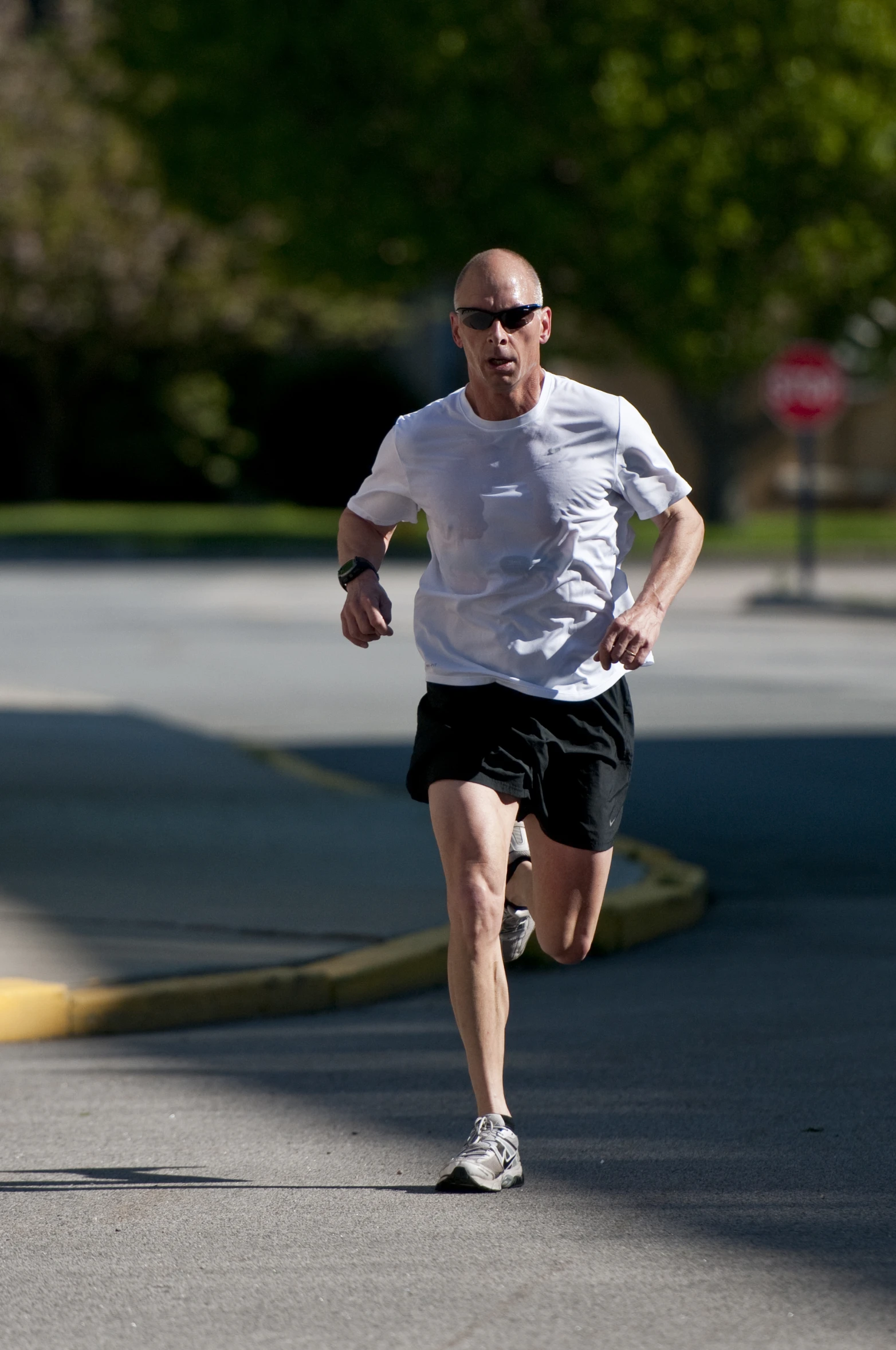 man running down the road at high speeds