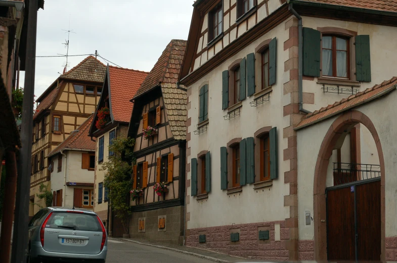 a car parked on a street next to tall buildings