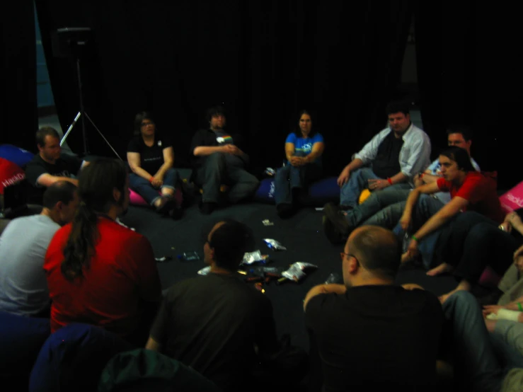 a group of people sitting in a circle