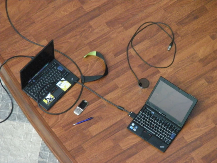 a table with some different electronic devices on it