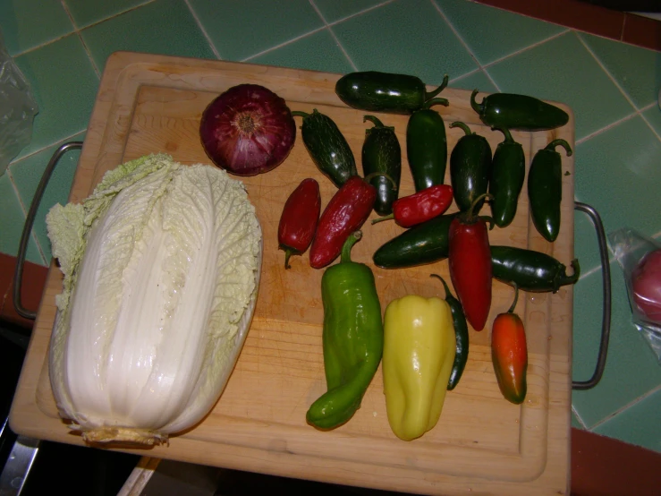 a  board holding different types of vegetables