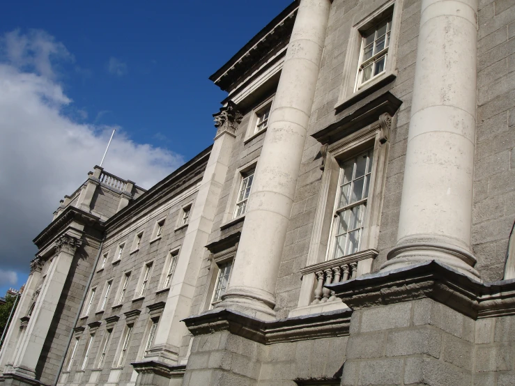 the building is built of stone with white trim