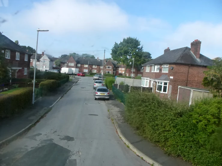 a residential area with lots of houses and a car parked on the road