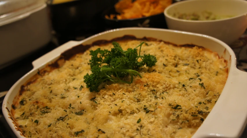 a casserole dish filled with vegetables and cheese