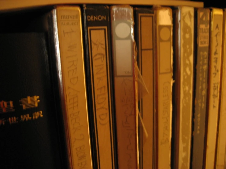 a close up of books with a light on them