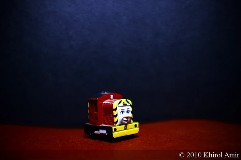 the toy is red, yellow and white and there is no image