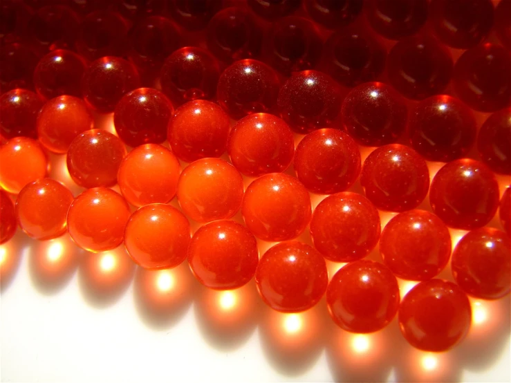 several shades of red beads are shown from above